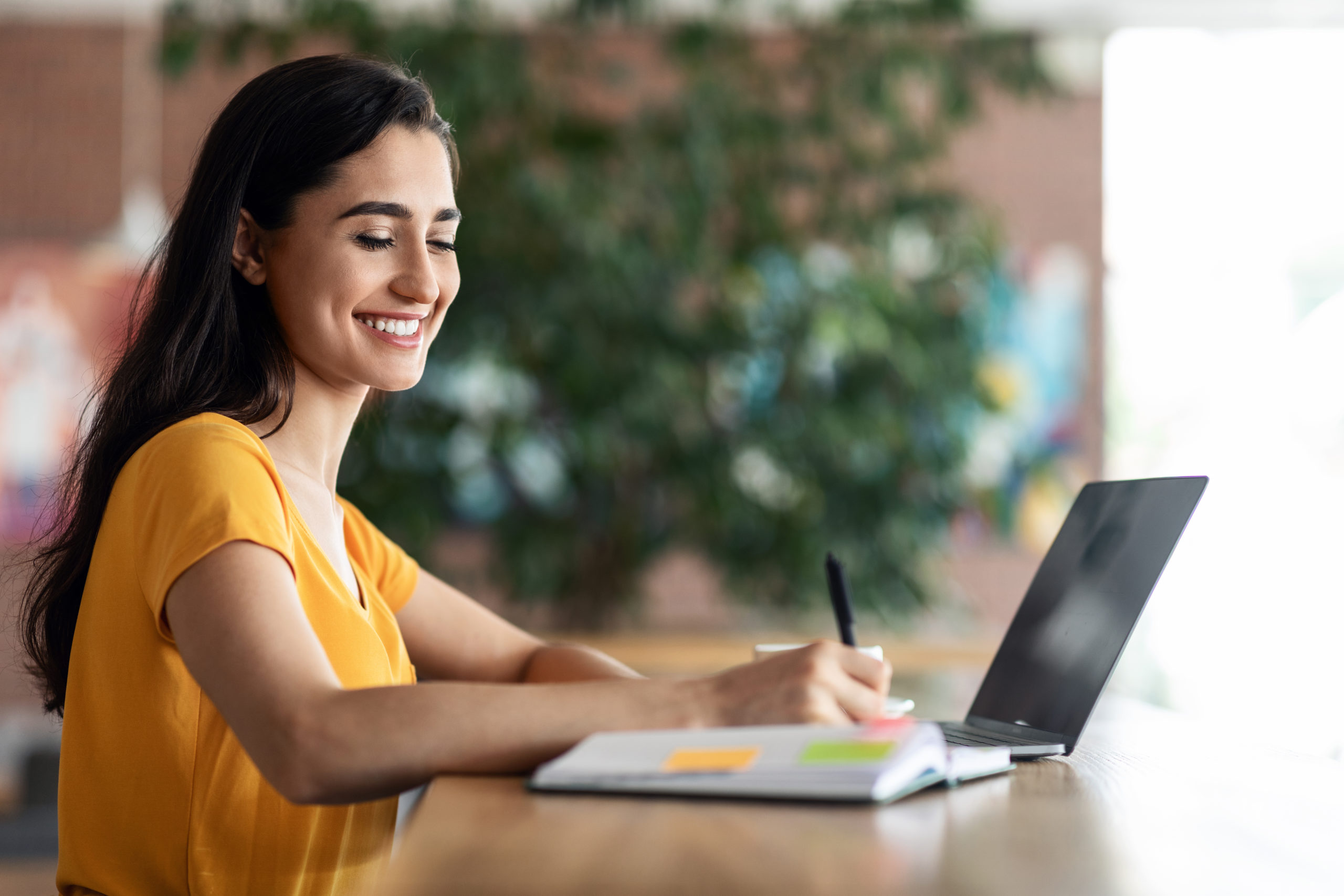 female-student-looking-for-part-time-job-using-lap-YVVCPEZ-scaled-1